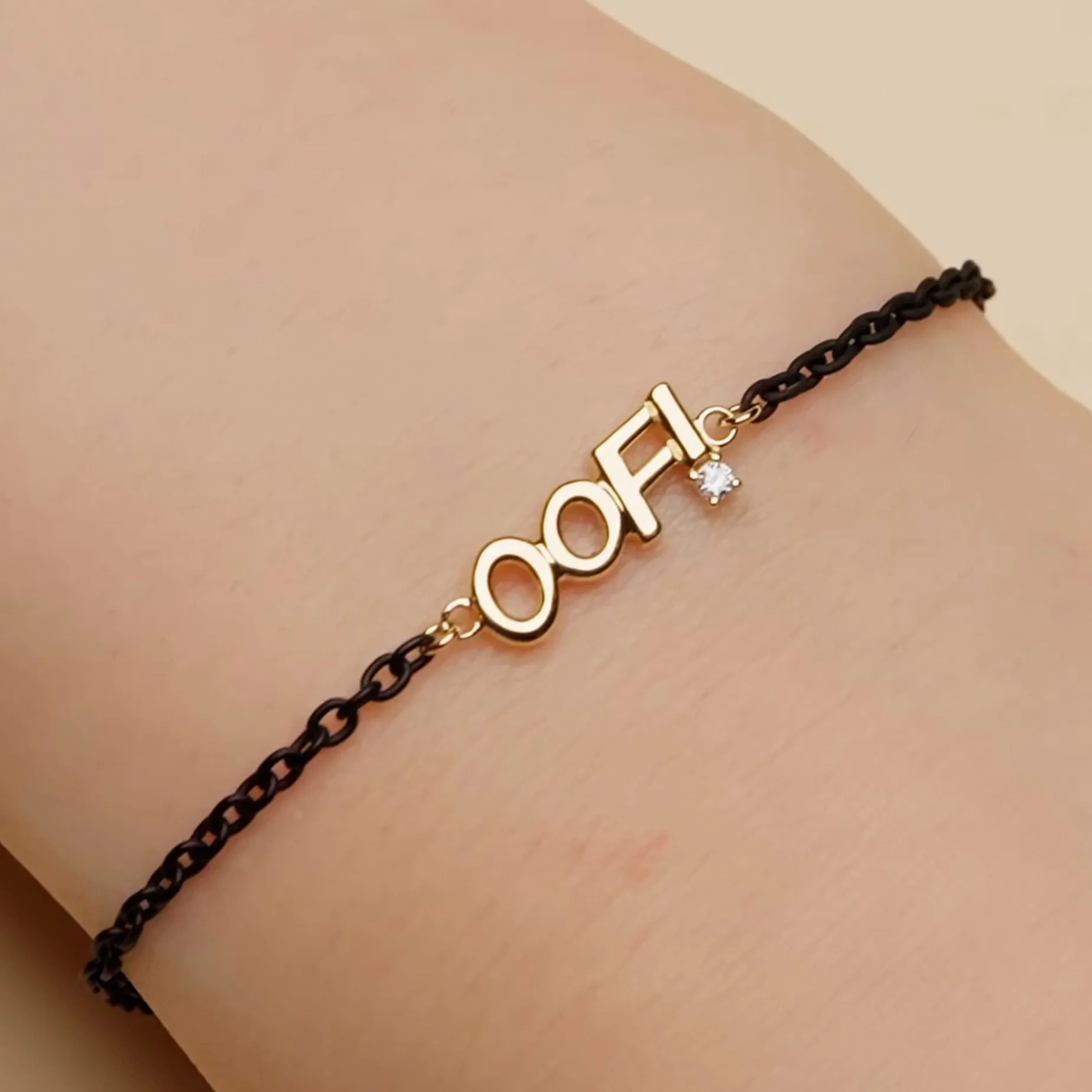 18K Gold and Black Steel “OOF” Bracelet