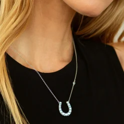 The Horseshoe Necklace with Blue Topaz Over Mother of Pearl